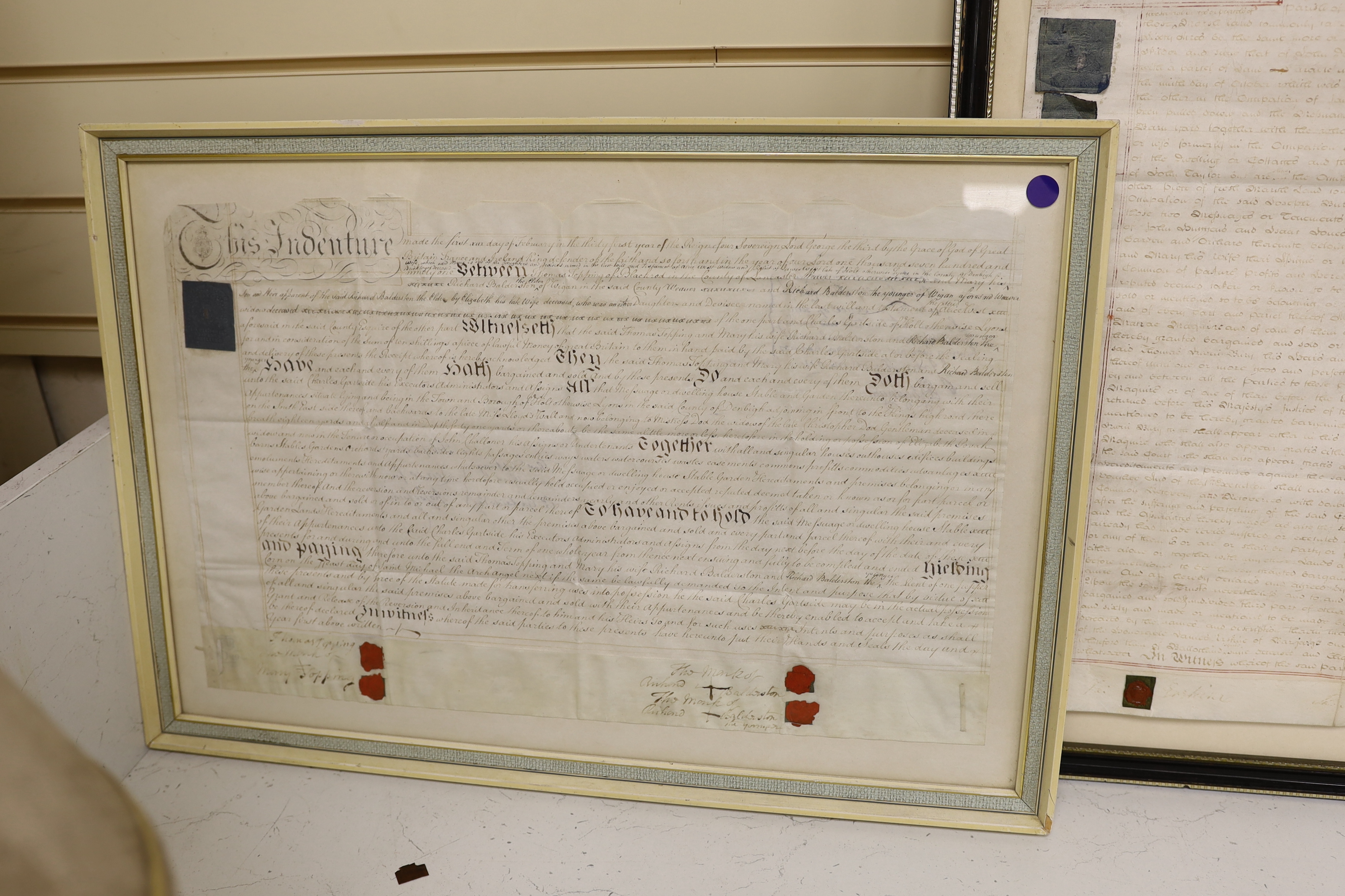 Two framed 18th century indentures, on vellum, largest 75cm wide x 63cm high